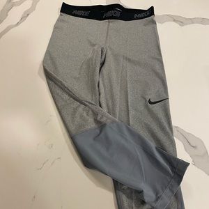 Nike dri fit cropped leggings with mesh calf detail. Size M.